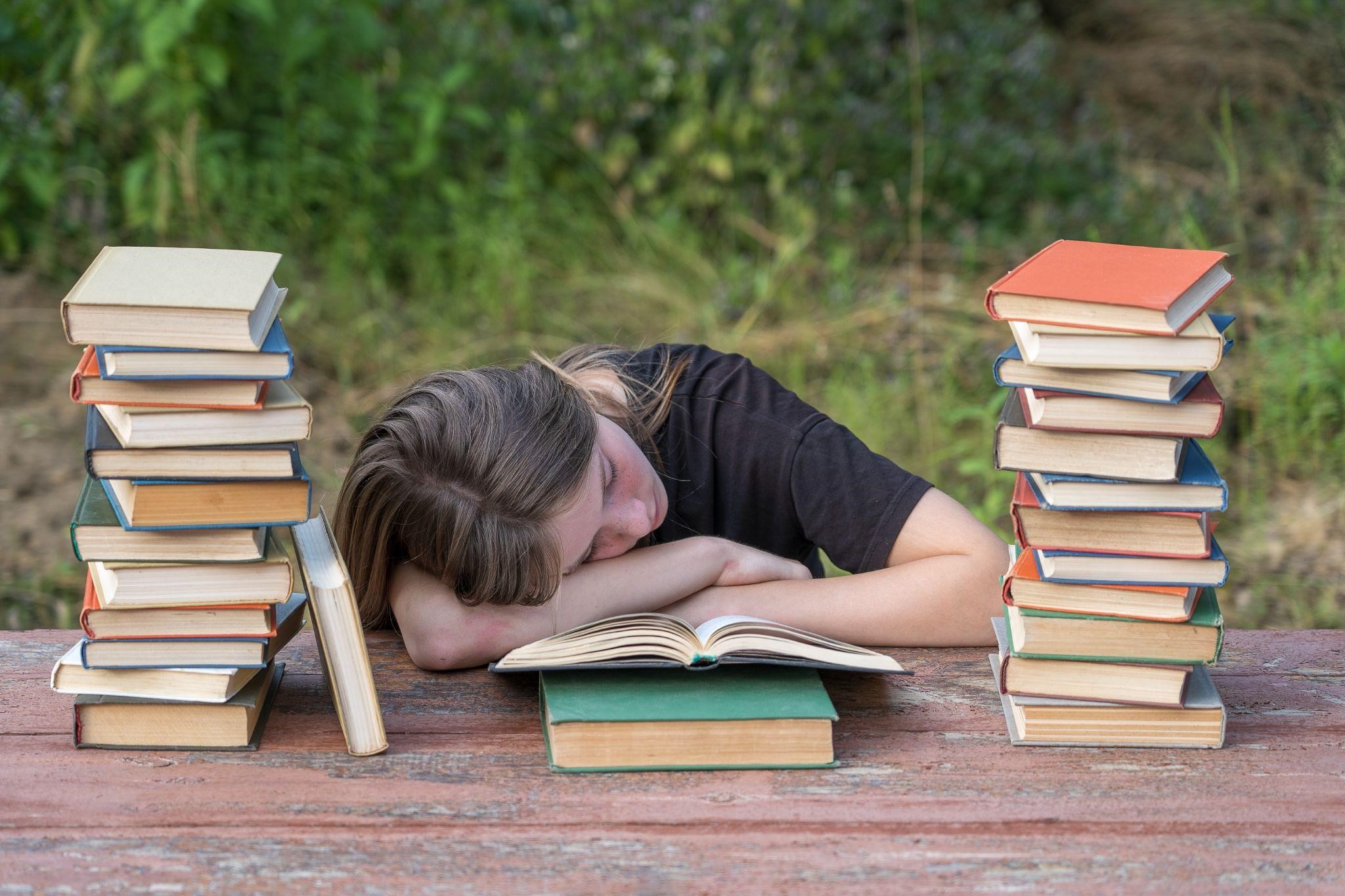 https://www.freepik.com/premium-photo/young-girl-fell-asleep-after-reading-books-wooden-table-garden_14684020.htm#fromView=search&page=2&position=2&uuid=42ee926a-45c1-4420-a0cc-5f7eb37e815c